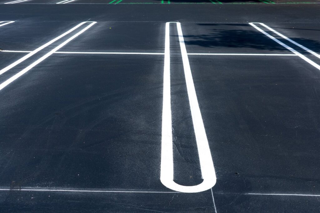 dark black colored asphalt parking lot