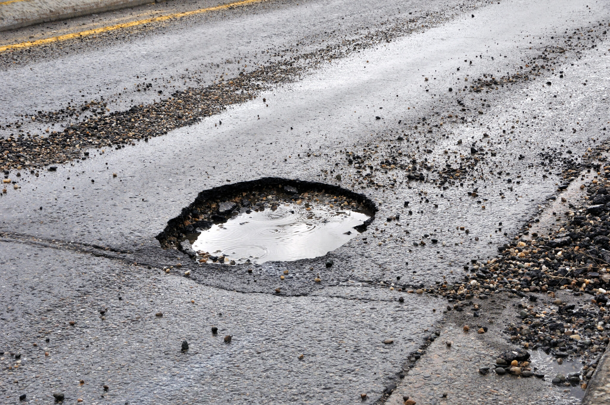 How Do Potholes Form? A Deep-Dive for Property Owners