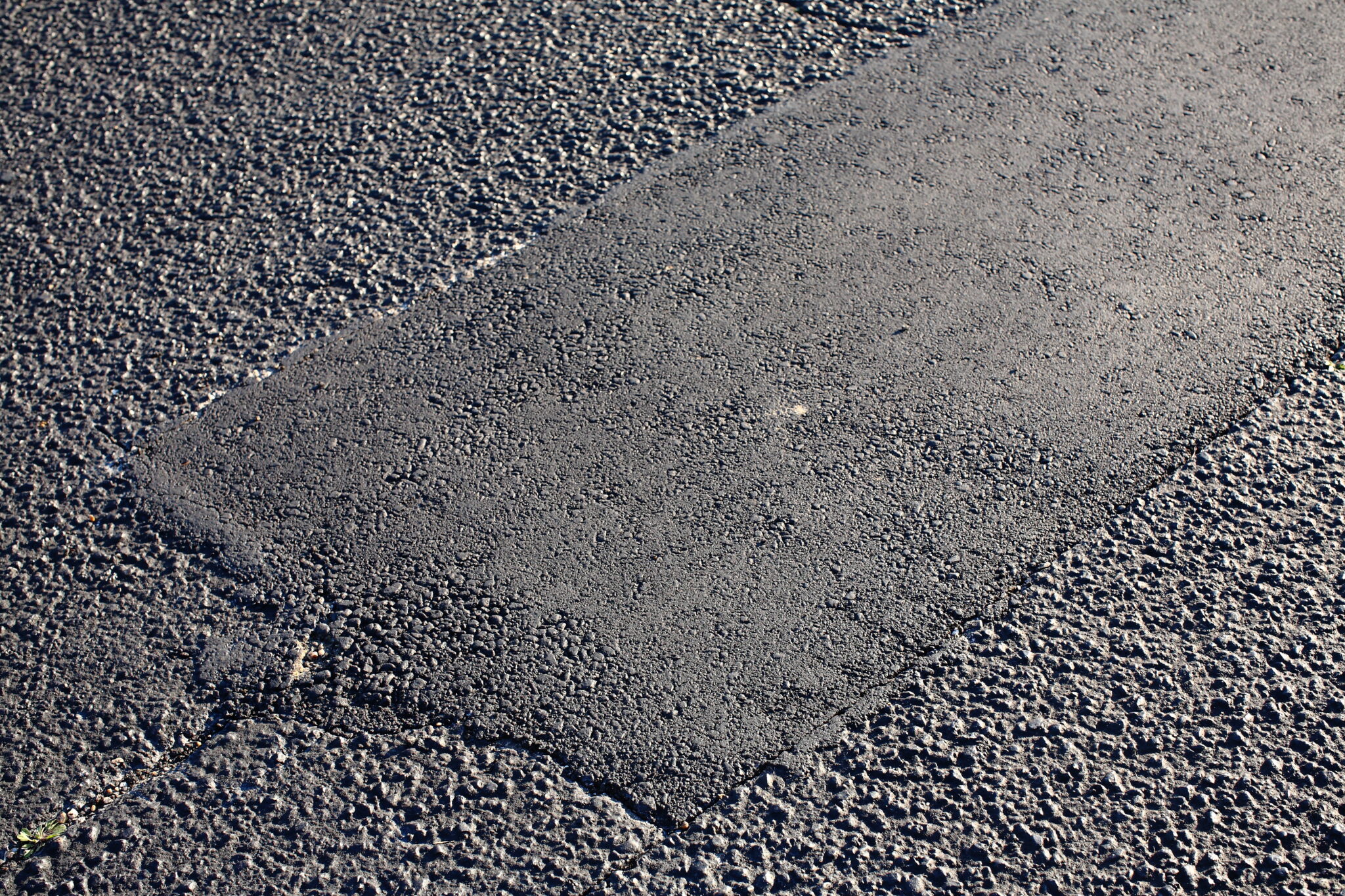 DIY Asphalt Patch Repair vs. Professional Patching: What Property Owners Should Know